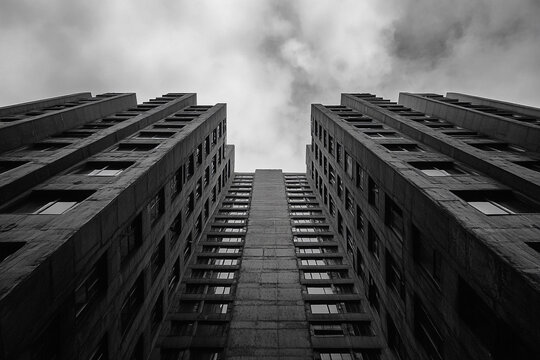 Futuristic Dystopian Brutalist Skyscraper Design Showcasing Monolithic Concrete Structures and Stark Urban Aesthetic