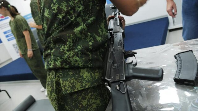 Soldier holding rifle during assembly training exercise