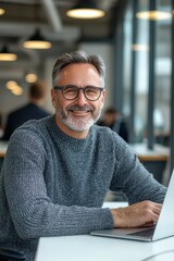 Smiling middle-aged man sitting at his desk in a cozy office environment with warm lighting and modern decor