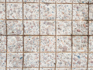 Surface of a concrete slab with a worn surface and a reinforcement mesh