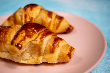 cup of coffee with croissant