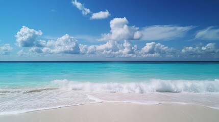 Fototapeta premium A beautiful beach with a blue ocean and white clouds in the sky