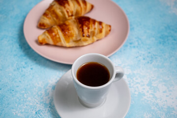 cup of coffee with croissant