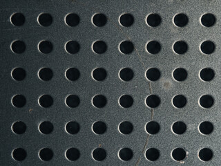 Anthracite steel or metal plate with dots or holes using as industrial background