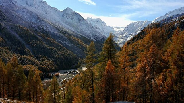 Landscape of the mountains, sky, forest and la Grouille village  in autumn in Switzerland.