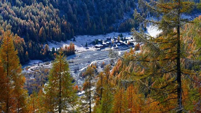 Landscape of the mountains, sky, forest and la Grouille village  in autumn in Switzerland.