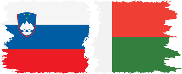 Madagascar and Slovenia grunge flags connection, vector