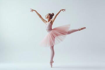 Fototapeta premium A woman in a pink tutu is dancing on stage. She is wearing a pink top and pink pants
