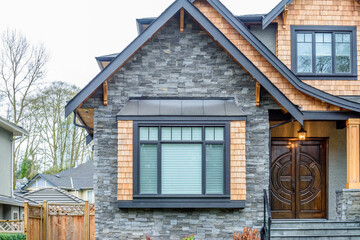 The top of the house or apartment building with nice window.