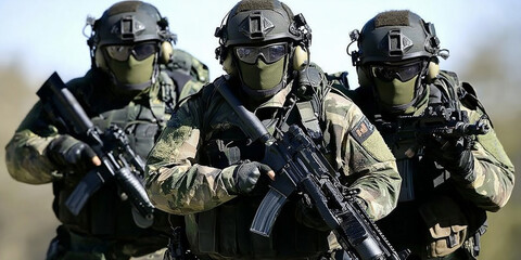 Three soldiers wearing camouflage holding rifles