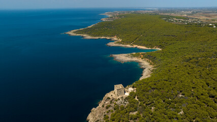 Obraz premium Aerial view of the tower of the Porto Selvaggio regional natural park in Salento. It is a protected natural area of ​​Puglia located in the province of Lecce.