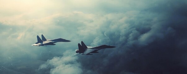 Two military fighter jets soar through a dramatic cloudy sky, showcasing power and agility in a dynamic aerial scene.