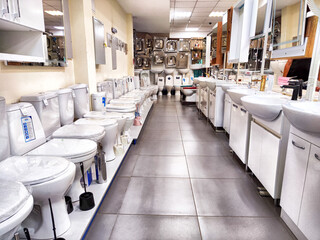 Kirov, Russia - August 18, 2024: Modern plumbing shop showcasing a variety of toilets and bathroom fixtures arranged neatly along the showroom floor