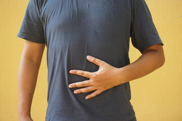 Man experiencing stomach pain or discomfort a visual representation of digestive issues