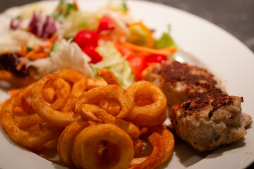 Meatballs with potatoes and salad