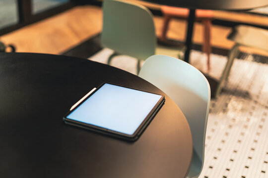 home kitchen office restaurant table graphic tablet reader white empty screen mockup