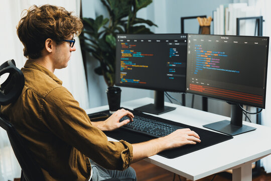 Working IT developer with stressful overworked in creating online software development coding on pc screen, thinking program for latest version application on website project at modern office. Gusher.