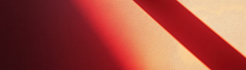 Fototapeta premium Diagonal Shadow on Textured Wall with Red and Orange Hues