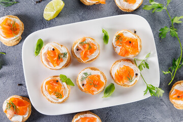 canape with cream and smoked salmon, top view