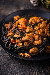 Halloween dish black pasta with bolognese