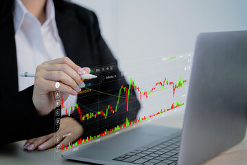 Investors analyzing stock market trading charts,technical price charts and indicators,business and technology stock chart data.