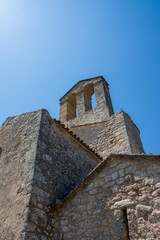 Low angle view of the castle church tower, Olerdola, Spain, Europe, August 8, 2024, vertical