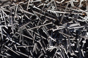 Many black self-tapping screws.