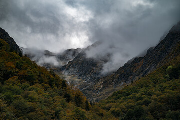 Mysterious autumn mountain with dramatic cloudy sky