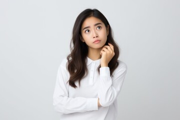 Woman with confused face portrait white photo.