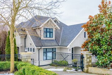 luxury house with big tree and nice landscape at winter in Vancouver, Canada