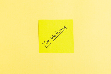 A yellow sticky note with the word 