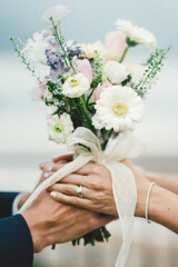 bride and groom holding hands