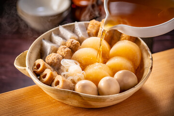 Japanese Oden, fish cake and vegetable stew.
Oden is a stew made with boiled eggs, radish (daikon), fish cakes and stock (dashi).