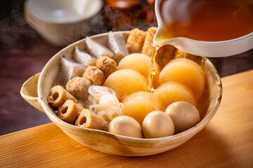 Japanese Oden, fish cake and vegetable stew.
Oden is a stew made with boiled eggs, radish (daikon), fish cakes and stock (dashi).