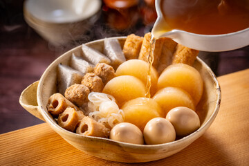 Japanese Oden, fish cake and vegetable stew.
Oden is a stew made with boiled eggs, radish (daikon), fish cakes and stock (dashi).