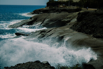 waves crashing on rocks