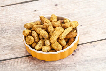 Raw ripe unpeeled peanut heap
