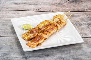 Grilled salmon skewer with sauce