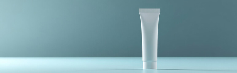 White cosmetic tube mockup on color background, minimalist display concept