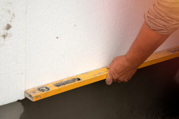 builder installs polystyrene foam sheets.