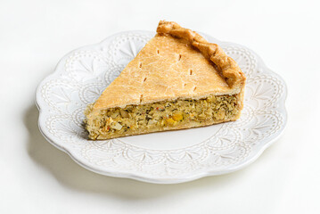 Chicken and egg pie on a light plate