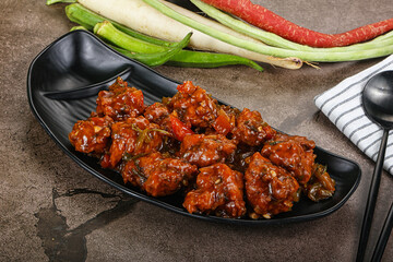 Manchurian chicken with sauce and spices