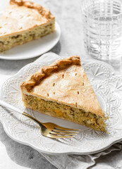 Chicken and egg pie on a light plate