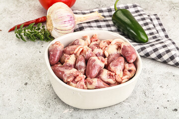 Fresh raw chicken hearts in the bowl