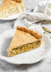 Chicken and egg pie on a light plate