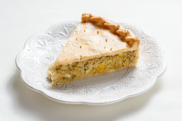 Chicken and egg pie on a light plate