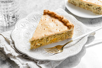 Chicken and egg pie on a light plate