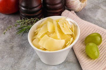 Parmesan cheese slices in the bowl