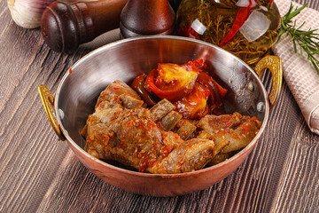 Baked lamb ribs with vegetables