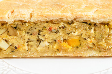 Chicken and egg pie on a light plate